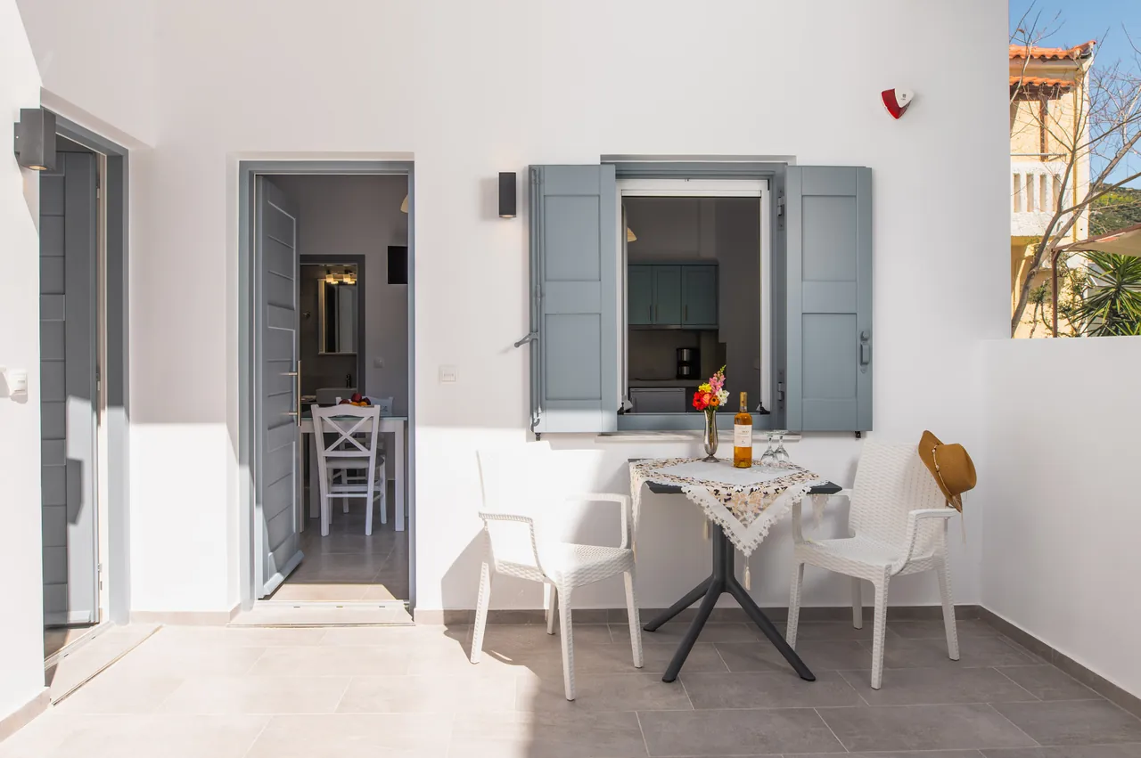 Ground-floor terrace with table and chairs outside a studio